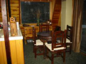 Dining area with large window lets the afternoon sun stream in.